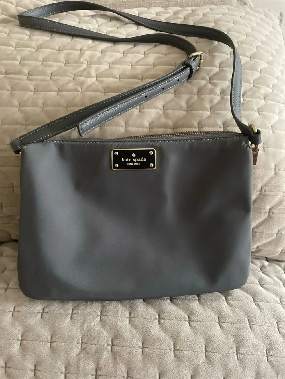 kate spade gray nylon crossbody with gold logo plaque